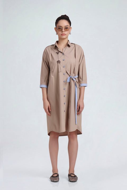 Zazu sand-toned cotton shirt dress for women with giraffe embroidery and light-blue waist tie, full-length front view