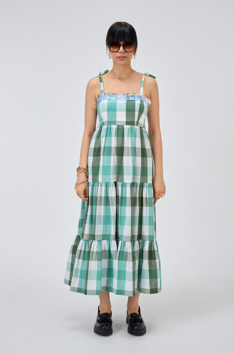 Nellie green and white check dress for women with bow-tied straps, tiered skirt and iridescent sequin neckline, front view
