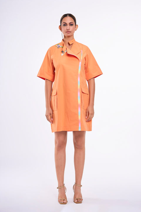 Tangelo orange dress for women with asymmetrical rainbow zip, bird embroidery and utility pockets, front view