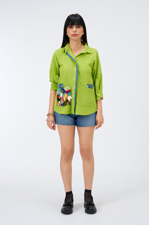 Chatterbox lime green cotton shirt for women with beaded pocket, full-length front view with denim shorts