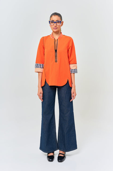 Toriq tangerine shirt for women with black zipper, striped yoke and contrast cuffs, front view