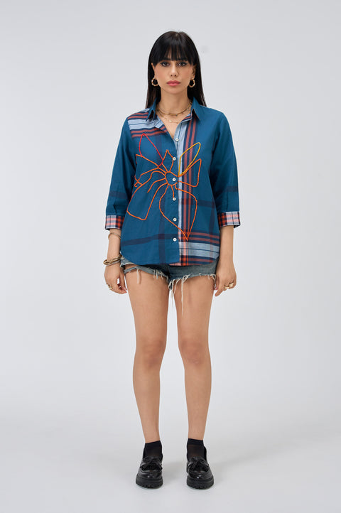 Gridlock Bondi blue plaid shirt for women with orange floral embroidery and checked cuffs, front view