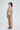 Zane sand-beige cotton co-ord set for women, side view of puff-sleeve shirt and barrel-leg trousers