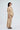 Zane sand-beige cotton co-ord set for women, side view showing gathered 3/4 sleeve and barrel-leg trousers