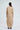Zane sand-beige cotton co-ord set for women, full-length back view with plain back and barrel-leg trousers