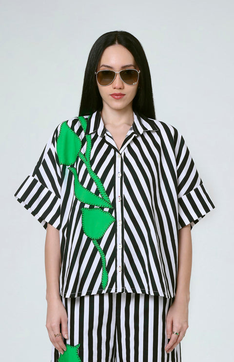 Juno black and white striped cotton shirt for women with bold green floral appliqué, front view