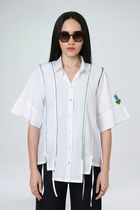 Sora white cotton shirt for women with contrast piping stitch detail and a small floral sleeve patch, front view